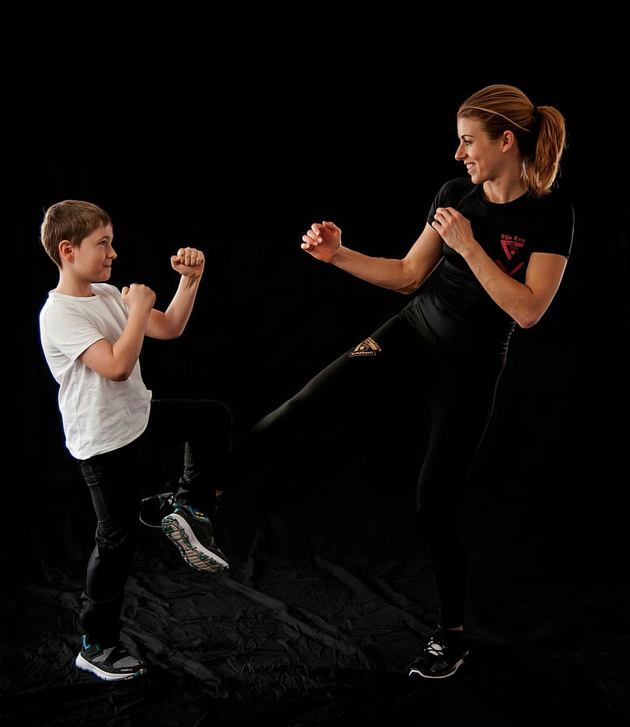 woman and boy performing martial arts, wing tsun, wing tzun, wing chun