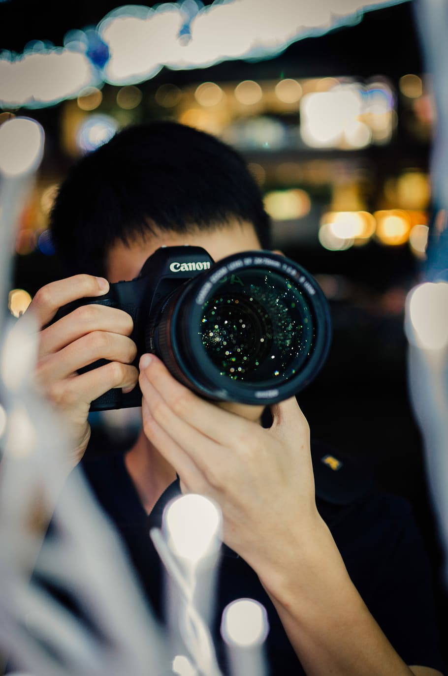 person using black Canon DSLR camera, selective photography of man taking photo HD wallpaper