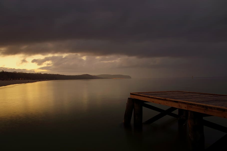 brown wooden dock in front of body of water, bridge, sea, twilight HD wallpaper