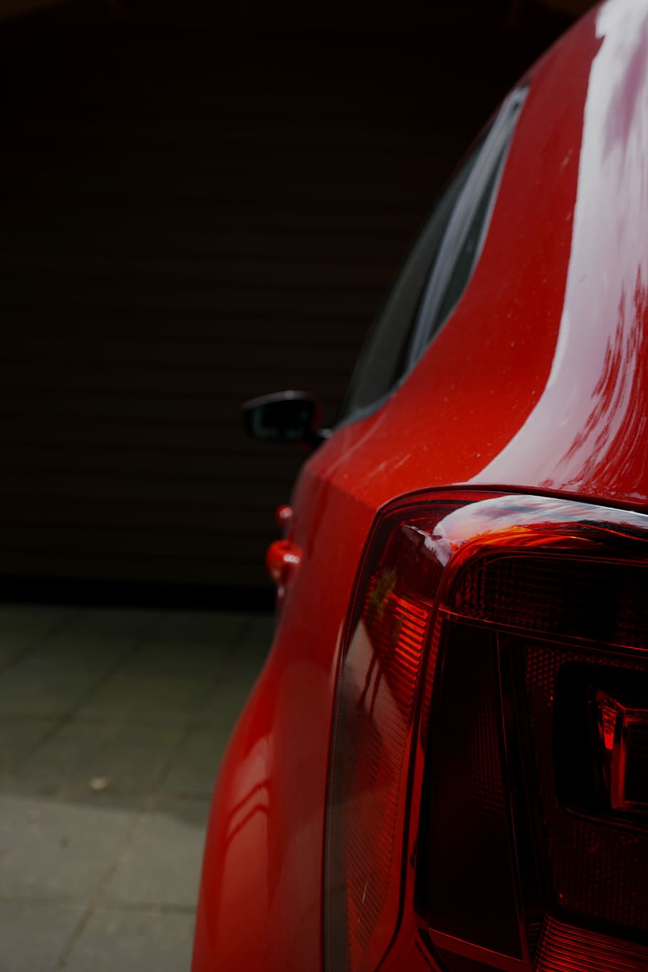 red vehicle park in room, closeup photography of red car, tail light HD wallpaper