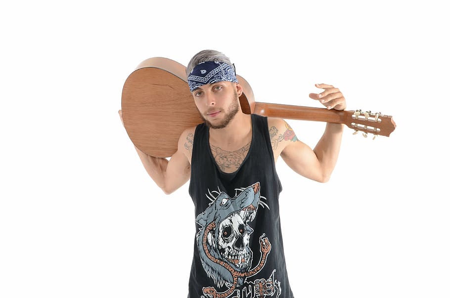 man wearing black tank top while carrying brown classical guitar HD wallpaper
