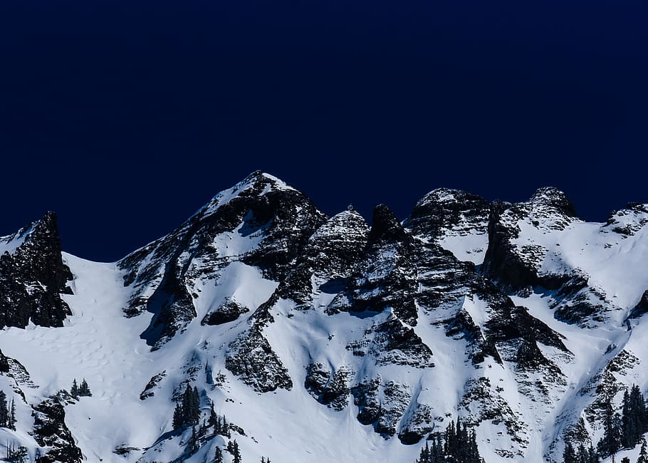 black stone mountain covered by ice, glacier mountain under blue sky HD wallpaper