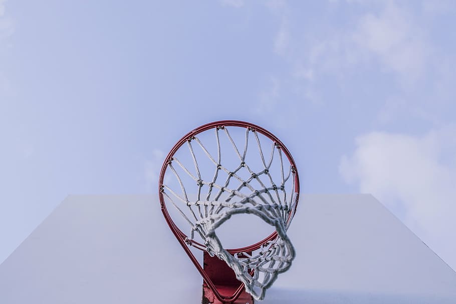 low-angle photography of red basketball hoop, round, ring, net