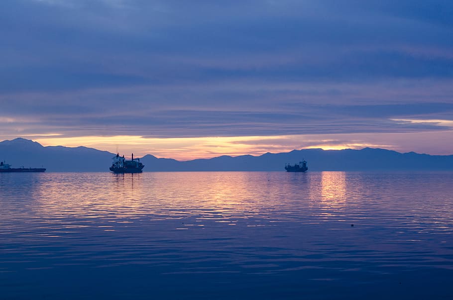 ship on body of water during golden hour, silhouette of two boats HD wallpaper