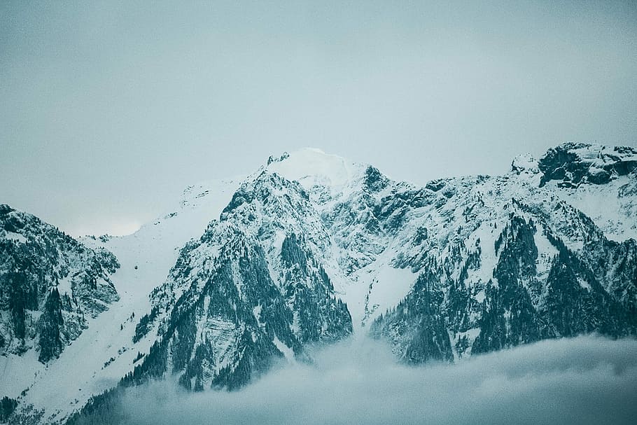 aerial photography of snow covered mountain, snow covered mountains under cloudy sky HD wallpaper
