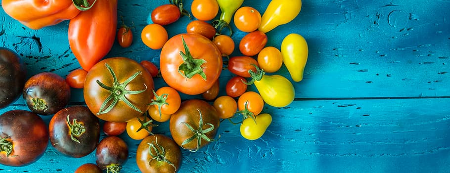 Fresh tomatoes on a table, assorted tomatoes, colorful, cherry tomato HD wallpaper