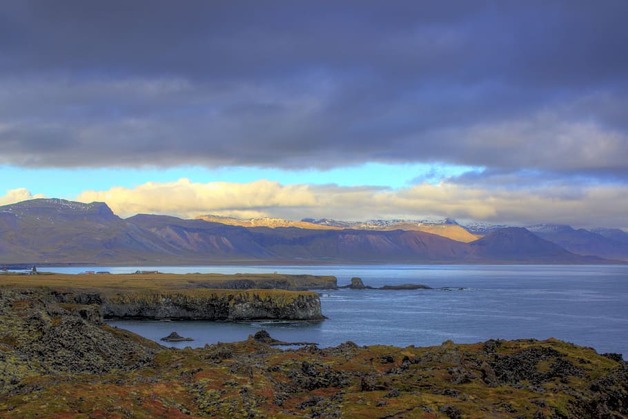 mountain surrounded by calm body of water, coast, shore, cliff HD wallpaper