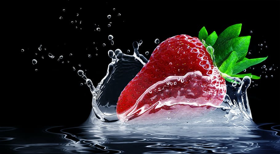 time lapse photography of strawberry splashing on water, water splashes