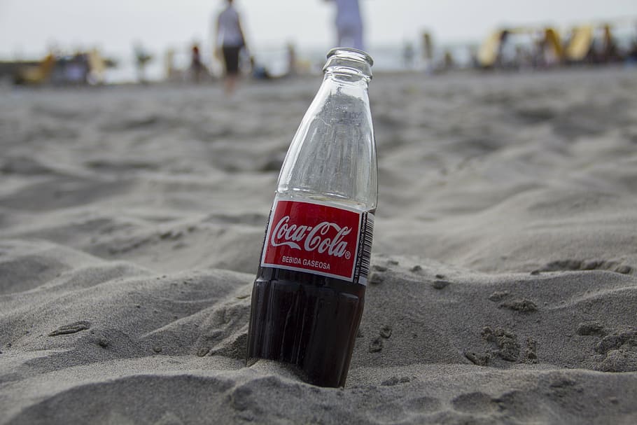 half filled Coca-Cola soda bottle, drink, coca cola, beach, soft drink