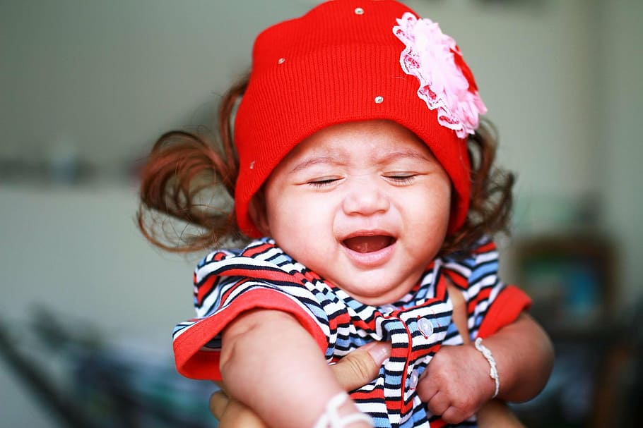 baby closing eyes wearing red hat, kids, girls, crying, baby crying