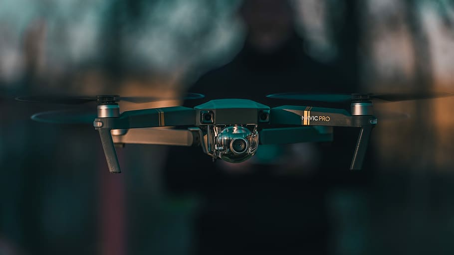 black quadcopter drone close-up photography, shallow focus photography of black quadcopter HD wallpaper