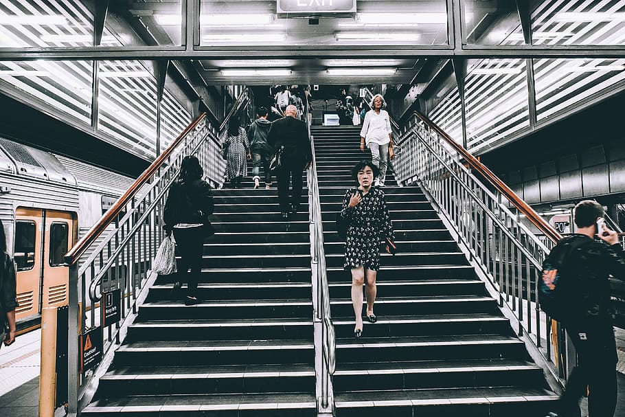 im that annoying person on the street, photo of people walking up and down on subway stairs