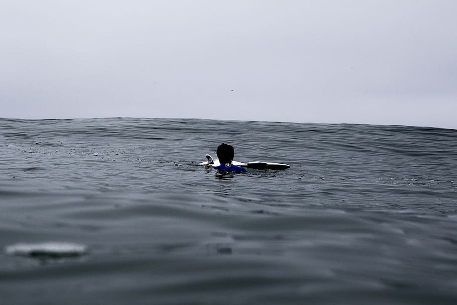 sea with ripples, grayscale photo of person floating on water HD wallpaper