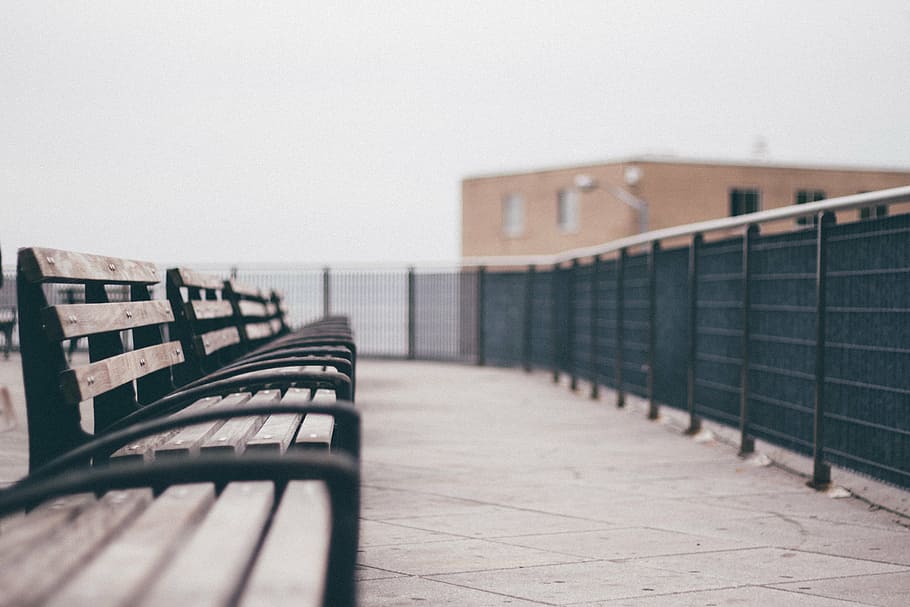 brown wooden bench near black metal fence on daytime, scene HD wallpaper
