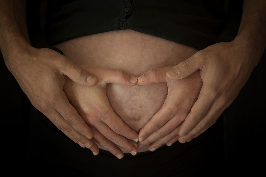 woman holding her tummy with man, pregnancy, hands, love, baby