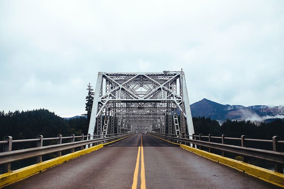 gray bridge between green leafed trees at daytime, structure HD wallpaper