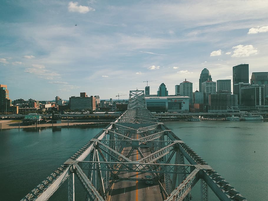 gray concrete bridge above body of water at daytime, high angle photography of gray metal bridge HD wallpaper