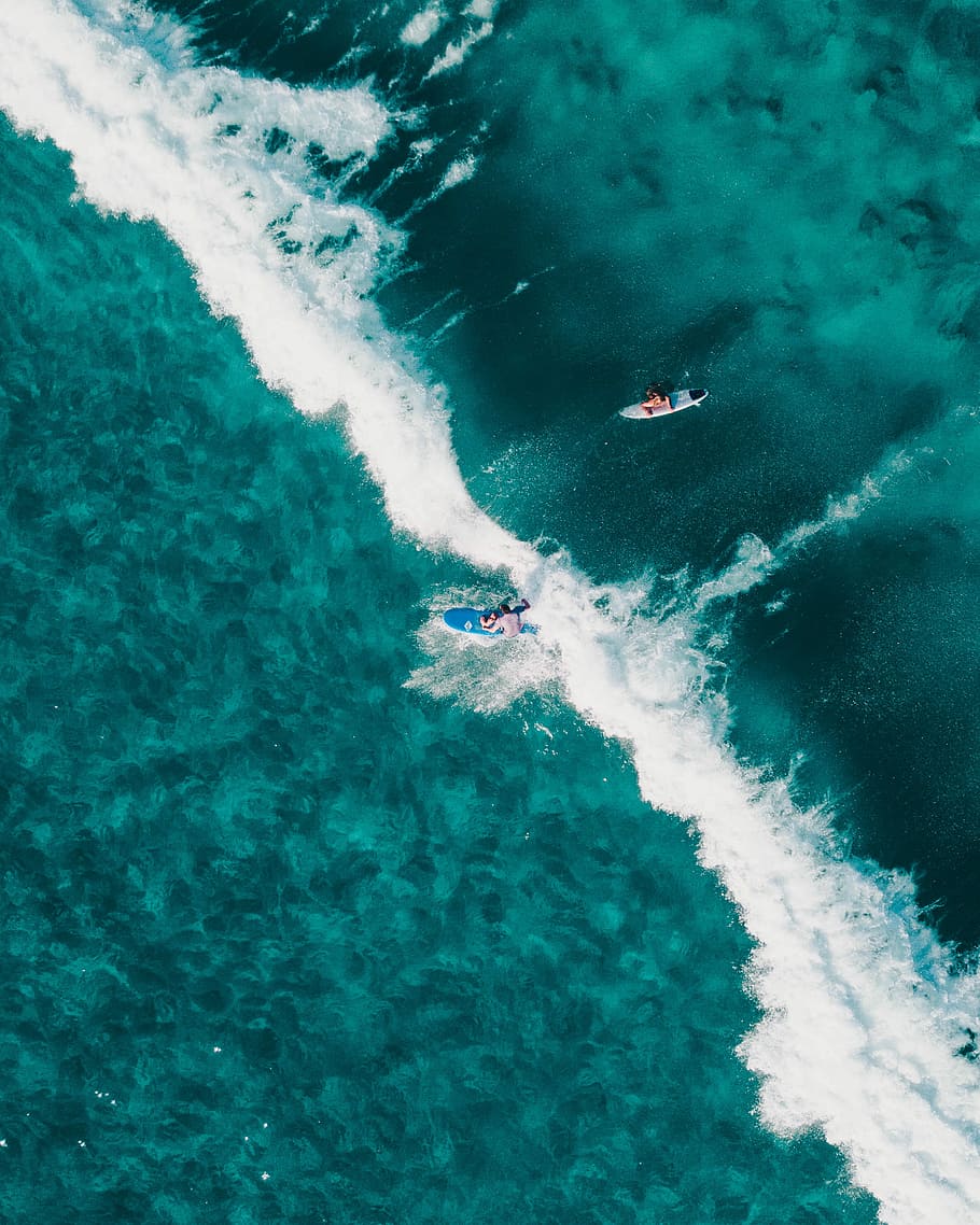 aerial view photo of two people surfing in body of water, aerial photography of two person surfing during daytime, HD wallpaper