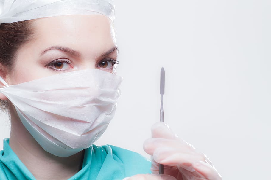 woman wearing face mask and holding scalpel knife, doctor, op
