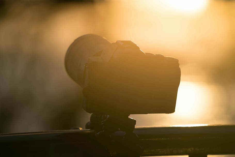 DSLR camera, sunrise, equipment, bloom, flare, sunset, focus on foreground HD wallpaper