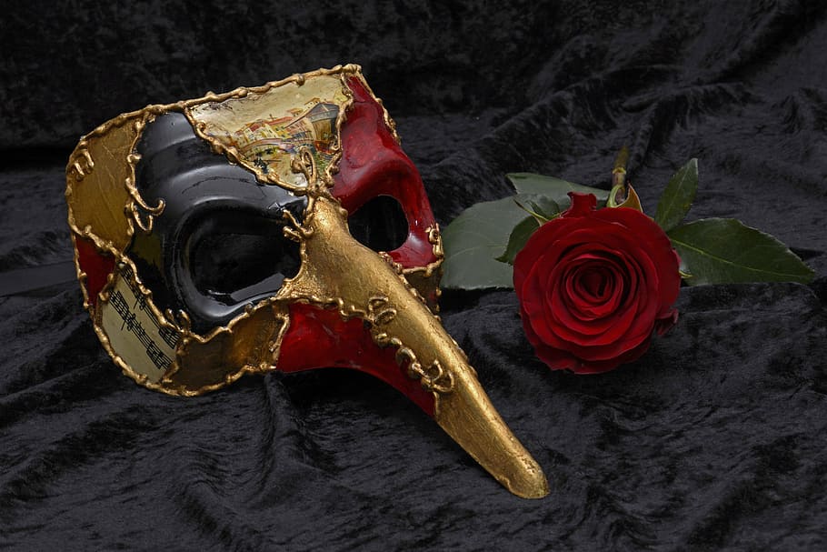 multicolored festival mask with red rose, carnival, venice, mysterious