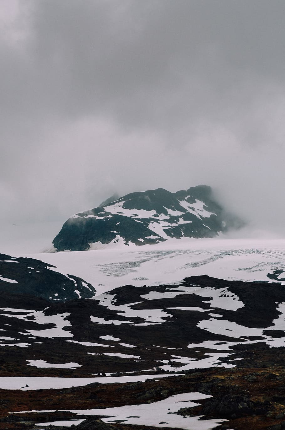 snow-covered land under cloudy sky, snowy mountain range during daytime HD wallpaper