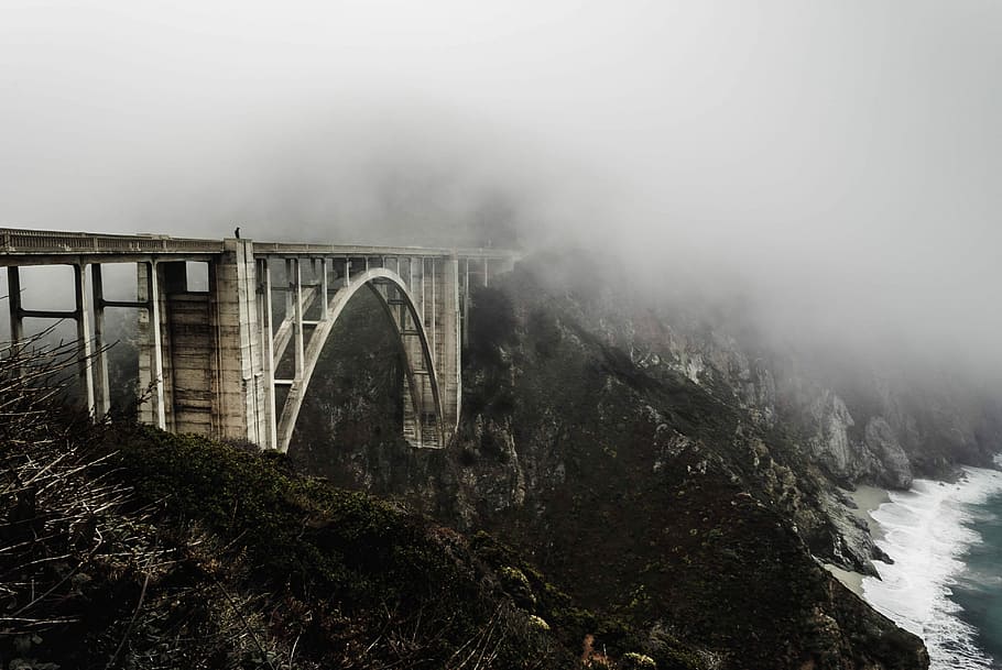 white concrete bridge covered with fogs, landscape photography of metal bridge near body of water HD wallpaper