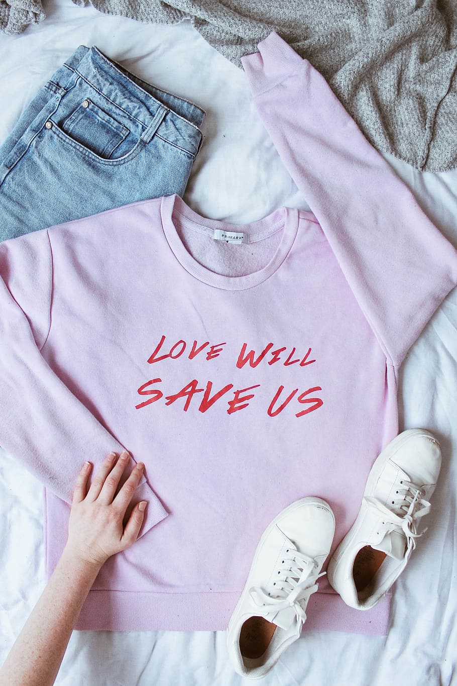 pink long-sleeved shirt on white textile near white low-top sneakers and blue denim bottoms, flat lay photography of purple sweatshirt and white low-top sneakers HD wallpaper