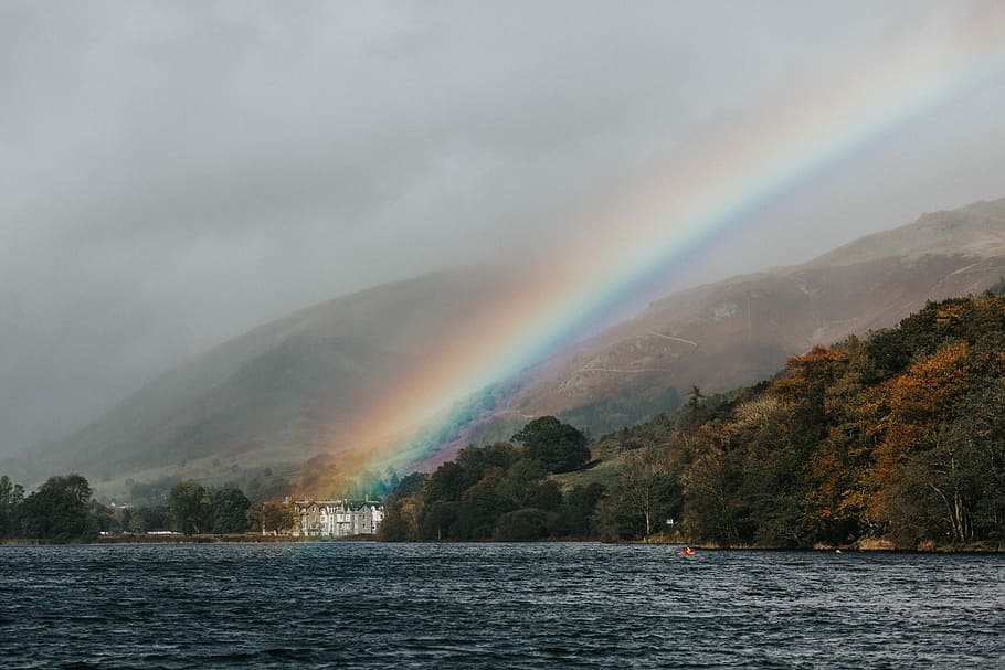 island surround with body of water, rainbow over rippling body of water HD wallpaper