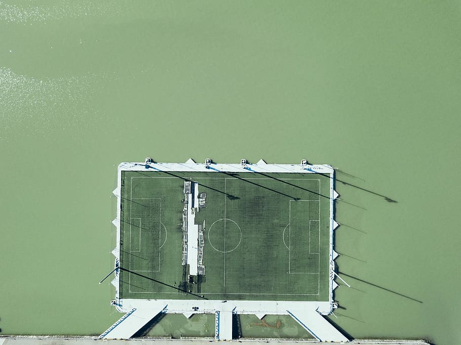 green basketball court board, aerial photo of soccer stadium