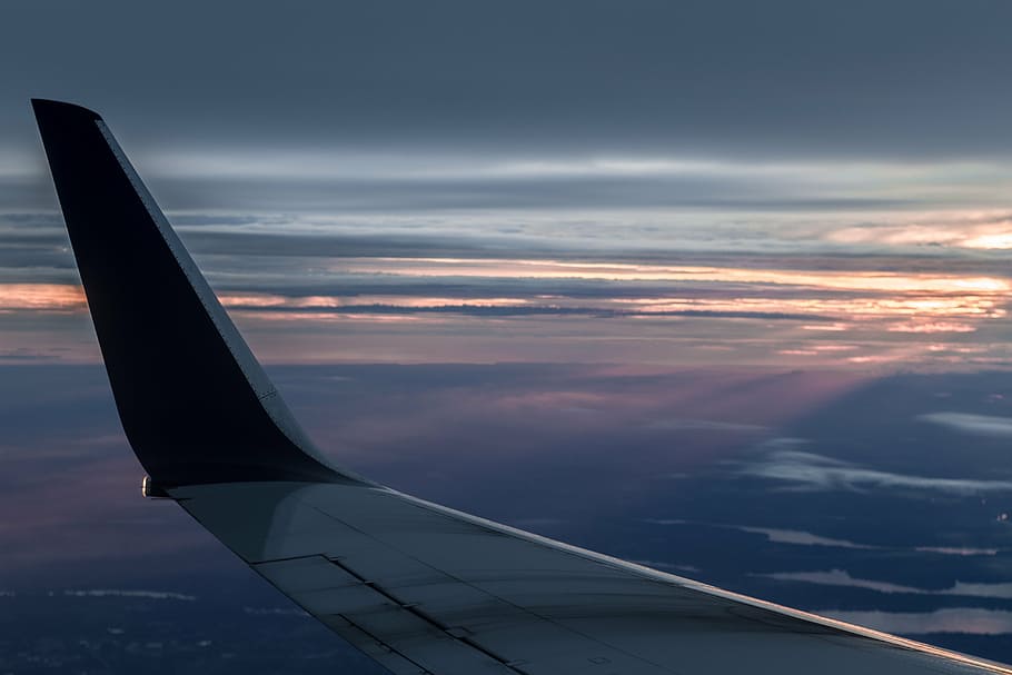 black and gray airplane wing with view of cloudy horizon, sunset HD wallpaper