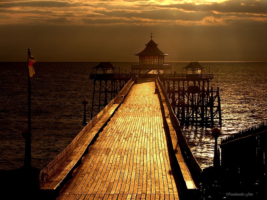 pier, sun, sea, dock, structure, sunset, sky, clouds, outdoors HD wallpaper