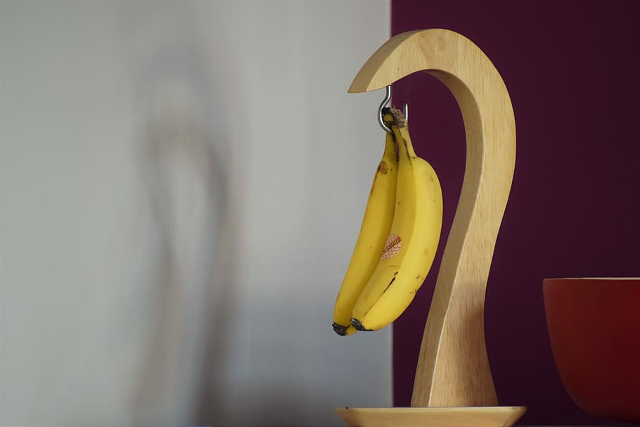 HD wallpaper: hanging yellow bananas on desk, two bananas hanged on banana  hook | Wallpaper Flare