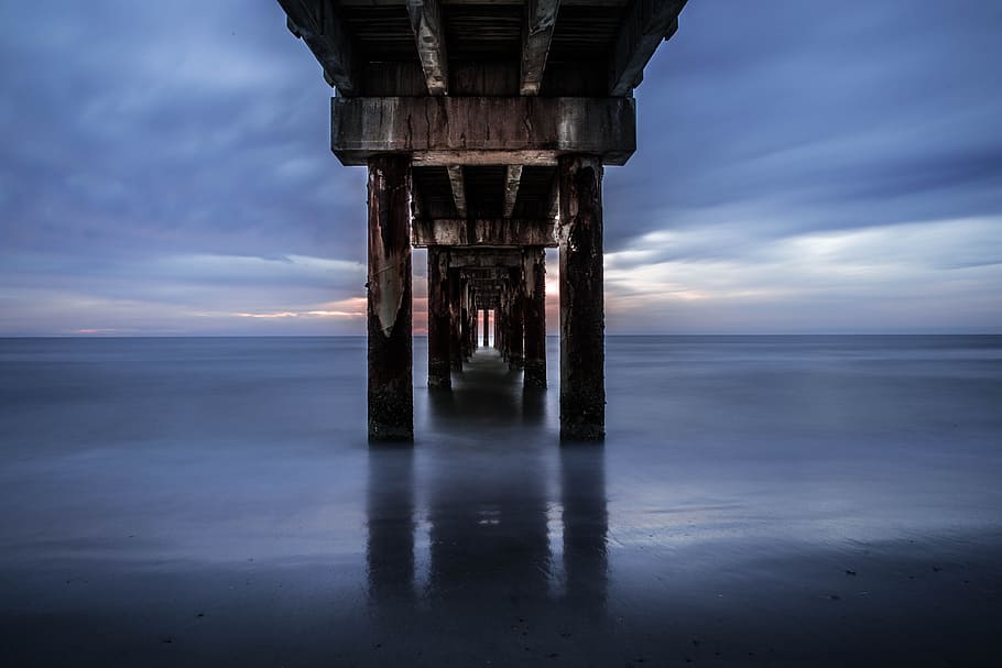 dock bridge near body of water, brown beach dock photography HD wallpaper