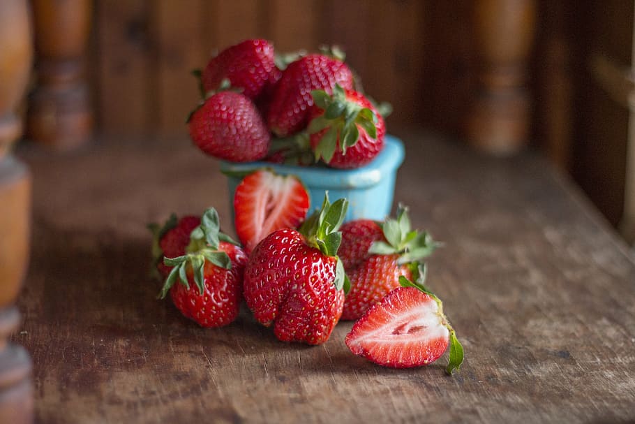 red strawberries on brown wooden surface, strawberry, cup, table HD wallpaper