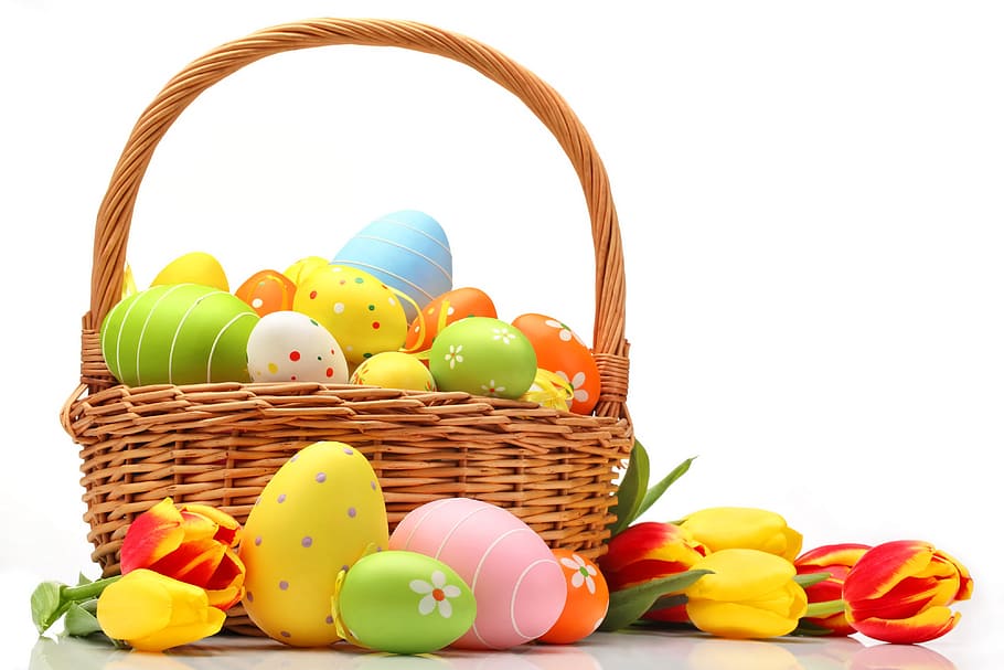 several assorted-color Easter egg decors on brown wicker basket HD wallpaper