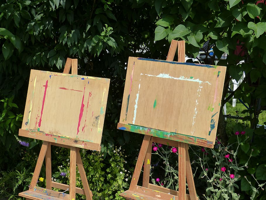 two brown wooden easel in front of green leafed plants, paint HD wallpaper