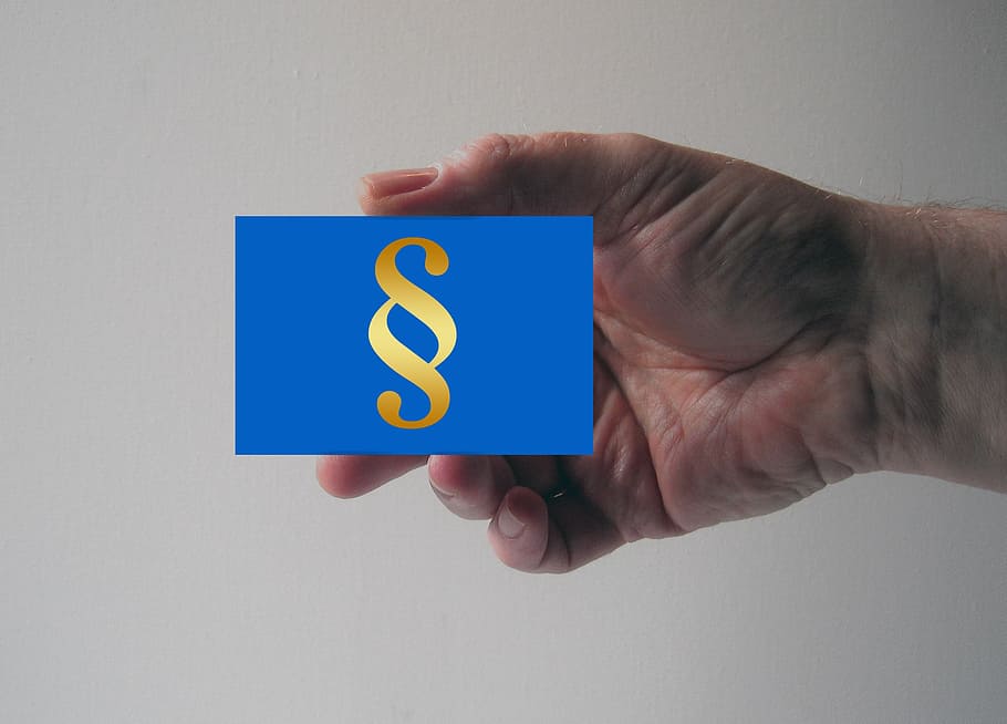 person holding blue box, clause, paragraph, book, right, jura HD wallpaper