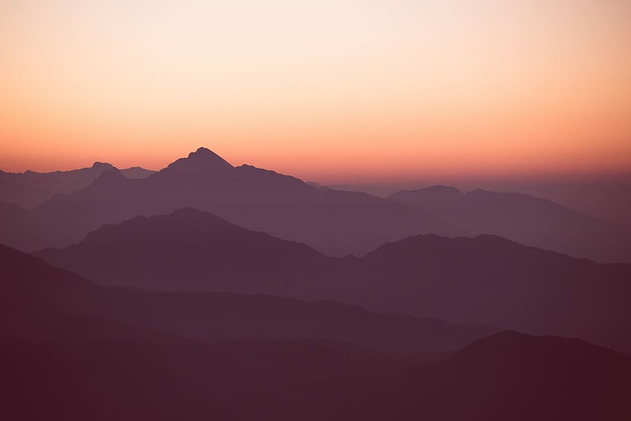 aerial photography of foggy mountain, silhouette of mountain during sunset HD wallpaper