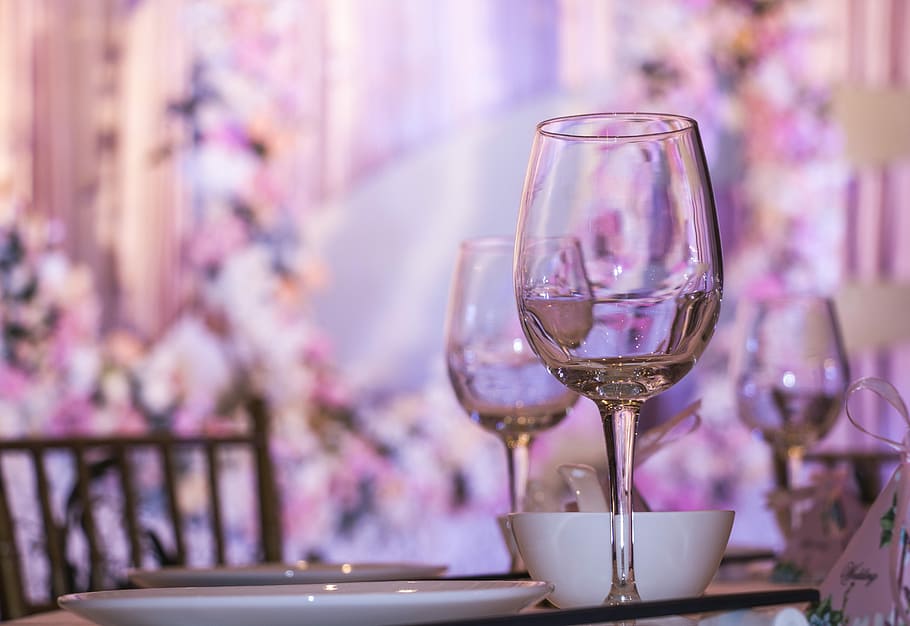 half-full clear wing glass near white ceramic plate and white bowl in table HD wallpaper