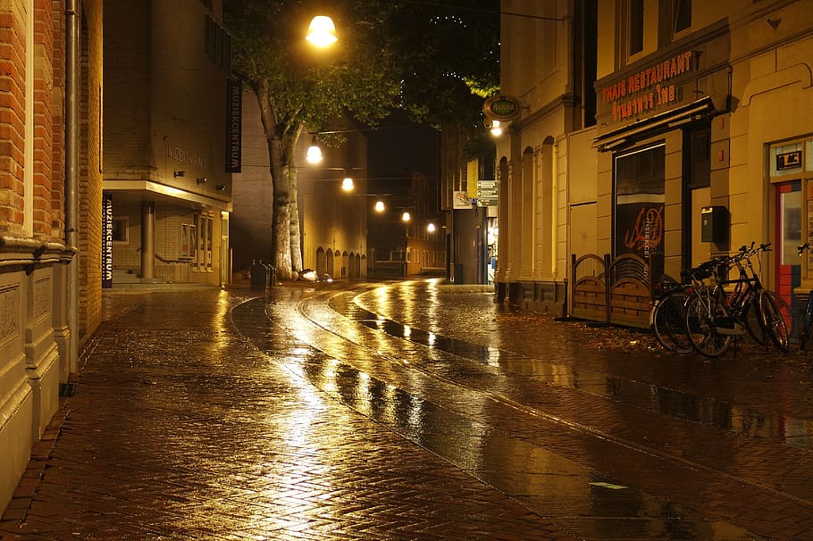 wet road and concrete buildings, wet street, night, reflections HD wallpaper