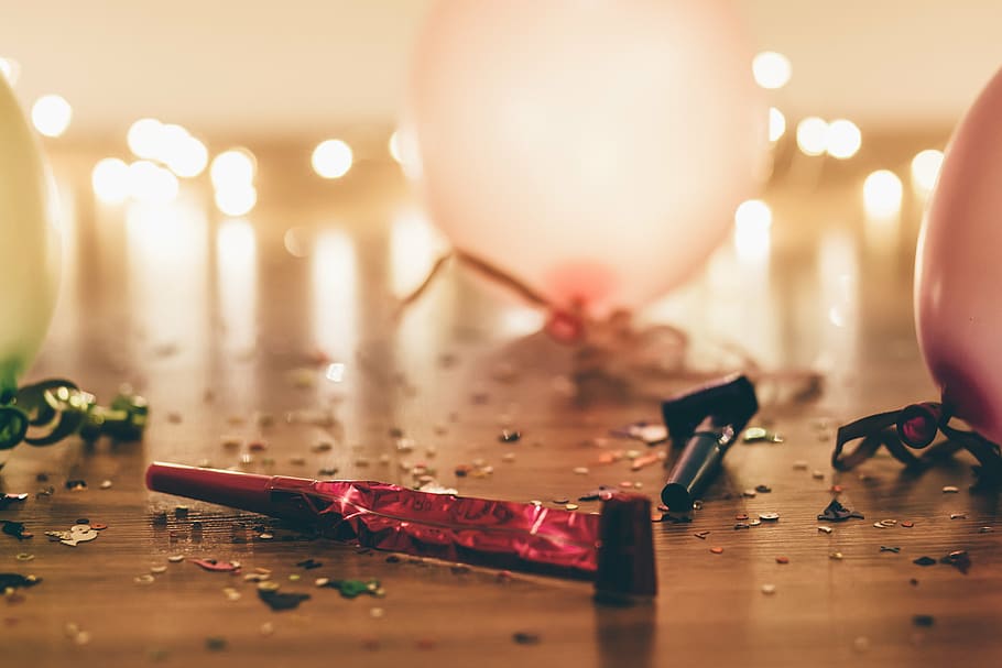selective focus photography of party whistles near balloons HD wallpaper