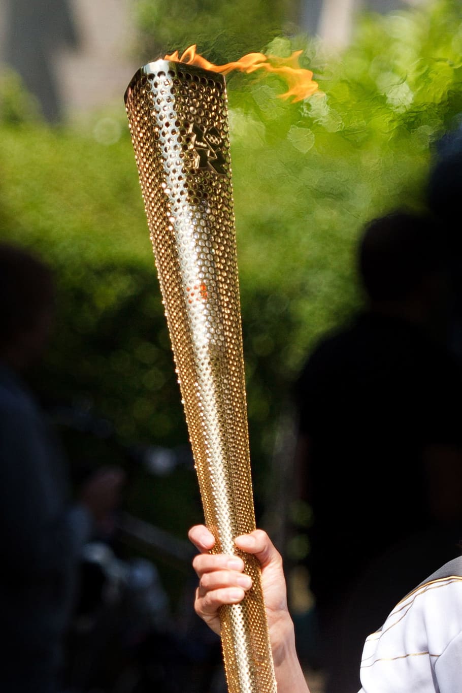 person holding brass-colored torch during daytime, carry, fire HD wallpaper