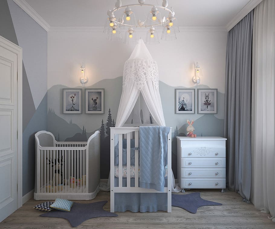 baby's white wooden crib beside crib and drawer chest, children