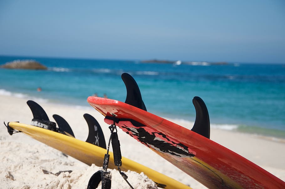 Yellow And Red Surfboards Near Blue Calm Body Of Water, beach HD wallpaper