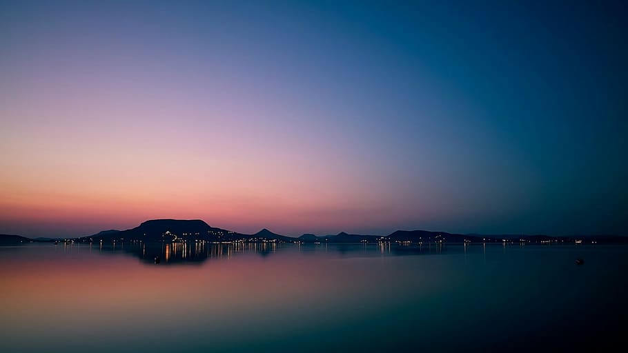 beach, clear sky, dawn, dusk, lights, mountains, ocean, outdoors HD wallpaper