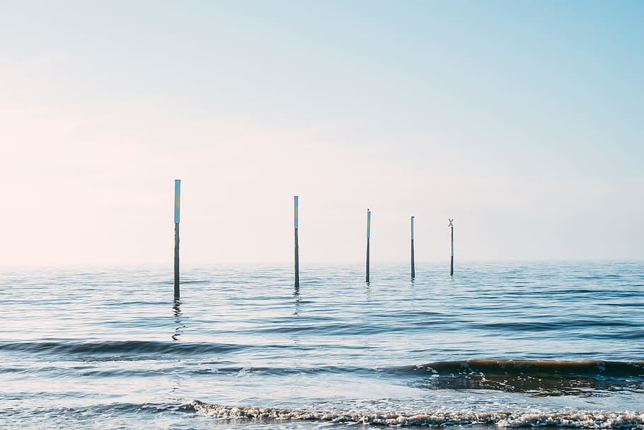 Poles in sea, landscape, nature, water, blue, sky, no People HD wallpaper