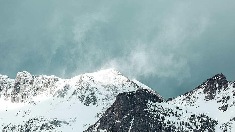 gray mountain covered with snow, rocky mountain under white ky HD wallpaper