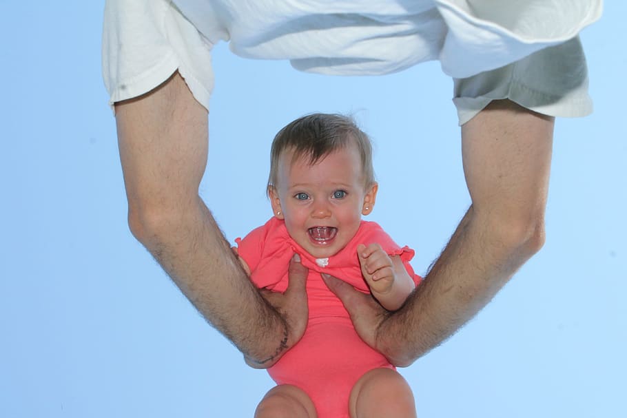 infant in pink onesie, girl, happy, playing, father, laughing