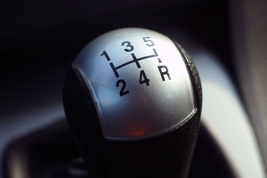 closeup photography of black and gray vehicle gear shift lever
